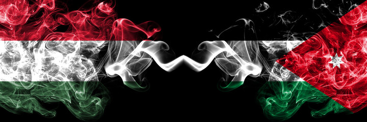 Hungary, Hungarian vs Jordan, Jordanian smoky flags side by side.