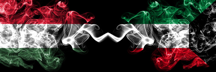 Hungary, Hungarian vs Kuwait, Kuwaiti smoky flags side by side.