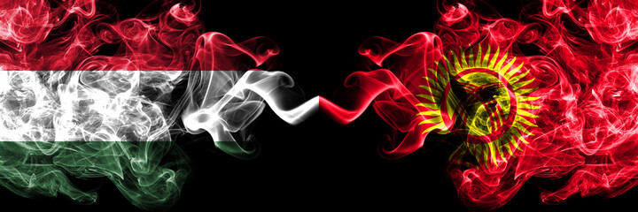 Hungary, Hungarian vs Kyrgyzstan smoky flags side by side.
