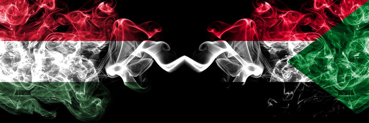 Hungary, Hungarian vs Sudan smoky flags side by side.