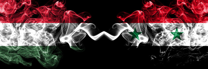 Hungary, Hungarian vs Syria, Syrian smoky flags side by side.