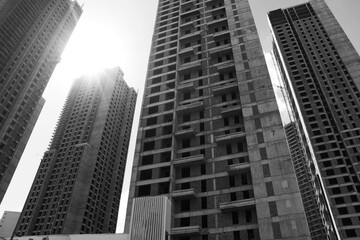 selective focus Tall buildings and blue sky. turkey istanbul's new buildings under construction reaching the clouds