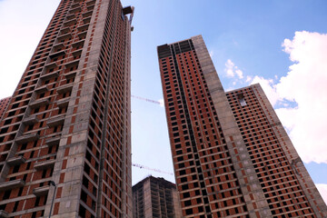 Obraz premium selective focus Tall buildings and blue sky. turkey istanbul's new buildings under construction reaching the clouds