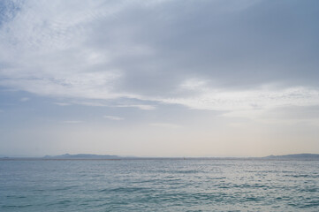 Beautiful landscape of Aegean sea in Athens at cloudy day. Silhouettes of islands in the mist. Nobody. Greece.
