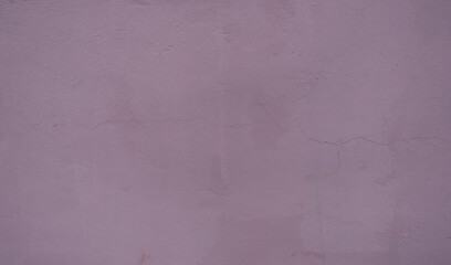 Plaster wall of light lilac color, with visible texture, smudges, cracks, spots.