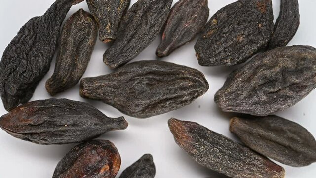 top view herb XiQingGuo or Chebulae Fructus Immaturus or Immature fruit of Medicine Terminalia rotating