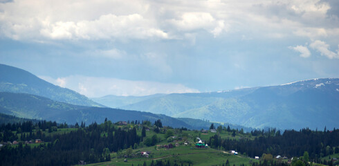 Fototapeta na wymiar Panorama of the Carpathian mountains in the snow on a spring day