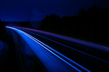Fototapeta na wymiar Night road lights. Lights of moving cars at night. long exposure