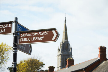 Modern street sign. Urban concept and road traffic directions in Malahide downtown.