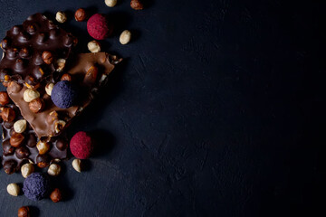 Chocolate bar, crushed pieces of dark chocolate and nuts.