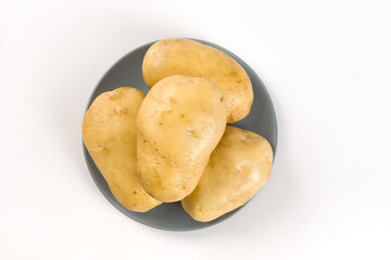 Raw potatoes isolated on white background