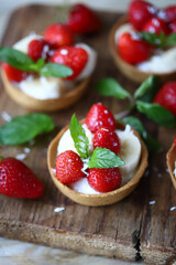 Delicious tartlets with strawberries and banana. Healthy summer dessert. Strawberry dessert.