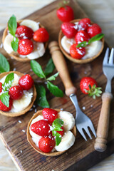 Delicious tartlets with strawberries and banana. Healthy summer dessert. Strawberry dessert.