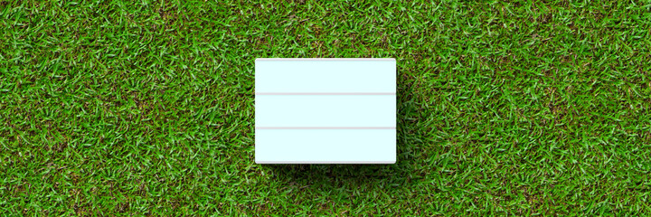 empty lightbox for own message on grass background