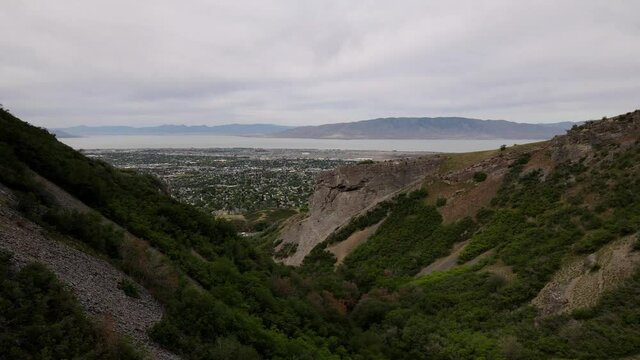 Drone ascending and flying down a canyon on the borders of Utah Valley