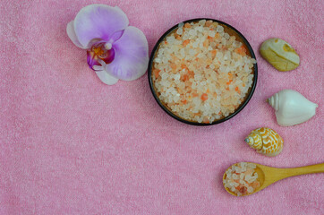 pink Himalayan salt and orchid flower, sea shells, the concept of beauty, spa and health, self-care and skin care at home