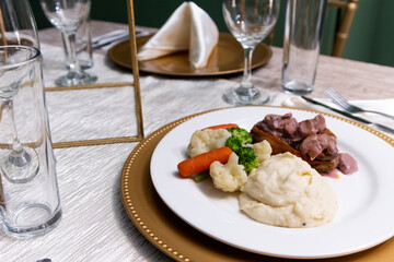 Close up to a fancy dinner plate in a event