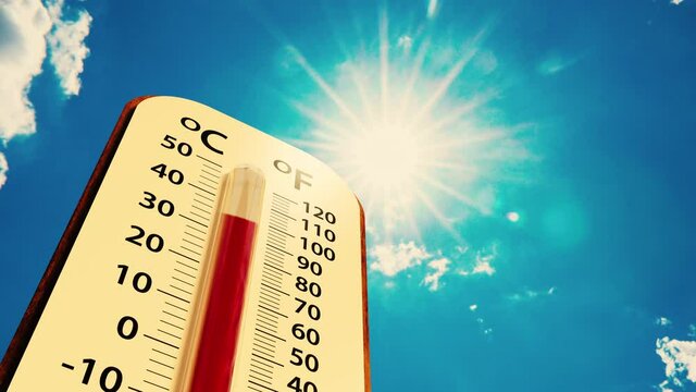 low angle view Thermometer on blue sky with sun shining in summer show higher Weather, concept global warming