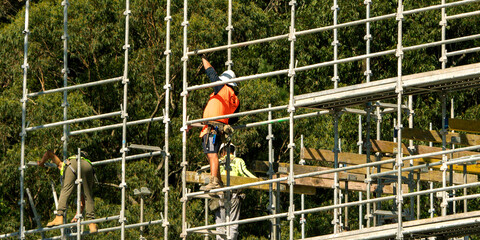  Installing scaffolding and flooring concrete formwork. Construction progress on new building site at 56-58 Beane St. Gosford, Australia. April 19, 2021.Part of a series.