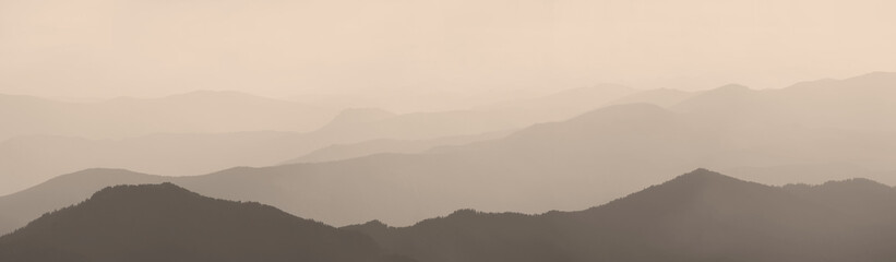 Mountains and hills in the morning haze, panoramic view