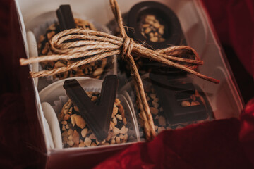 Fototapeta na wymiar Brigadeiros em uma caixa escrito love em chocolate