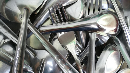 Shiny gleaming spoon parts made of stainless steel are used in the kitchen.
