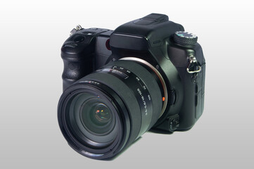Digital SLR camera with 16-105 lens on white background