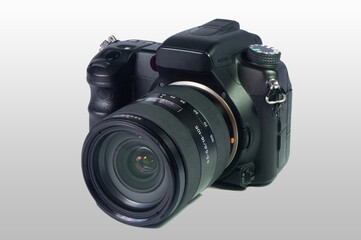 Fototapeta premium Digital SLR camera with 16-105 lens on white background