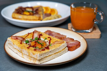 Modern breakfast, toasted bread, eggs, bacon on a table. Good healthy food.
