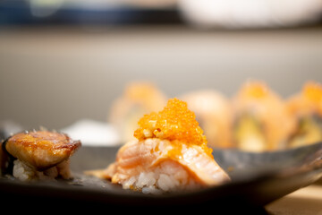 Salmon sushi decoration with roe on top