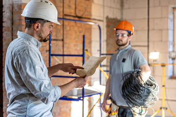 Two builders collaborate to build a new home.