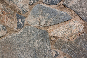 Background texture masonry from large stones with cement. Horizontal image.