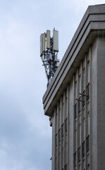Fototapeta na wymiar mobile communication base station, on building, telecommunication tower,