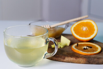 Herbal warming tea with ginger, honey and orange. High quality photoHerbal warming tea with ginger, honey and orange.
