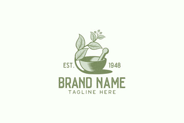Fototapeta premium Vintage herbal logo vector graphic with mortar, pestle, and herbal.