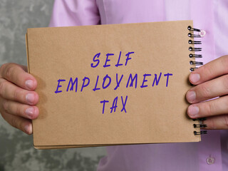  SELF EMPLOYMENT TAX sign on the sheet.