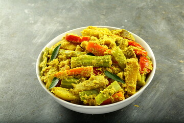 Bowl of delicious Aviyal dish, Kerala foods background.