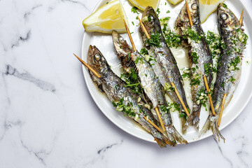 Homemade Grilled Sardines with Garlic, Olive Oil, Fresh Parsley, and Lemon