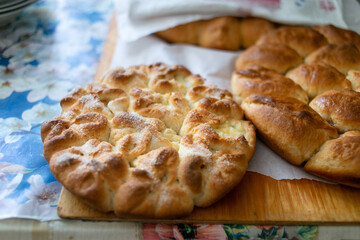 Fresh grandmother's pies cool on the table.
