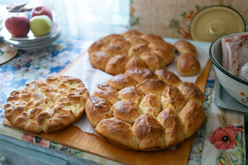 Fresh grandmother's pies cool on the table.
