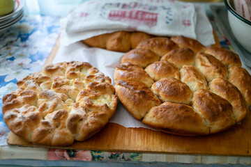 Fresh grandmother's pies cool on the table.
