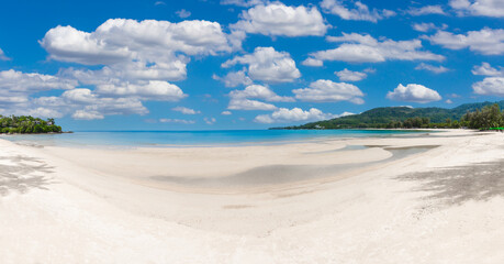 Fototapeta na wymiar tropical paradise beach with blue sky and mountain background.