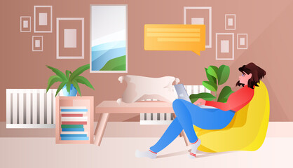woman sitting on beanbag and using laptop chat bubble communication social media network concept horizontal full length vector illustration