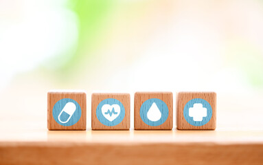 wood block with icon healthcare medical, Insurance for your health concept