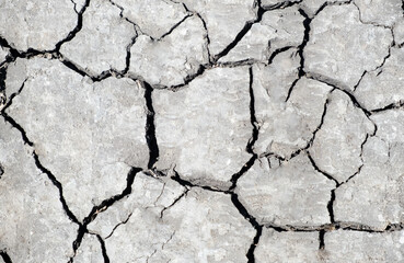 Cracked grunge gray ground background. Top view