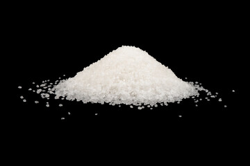 Heap of white sugar isolated on a black background. A pile of powdered white granulated sugar...