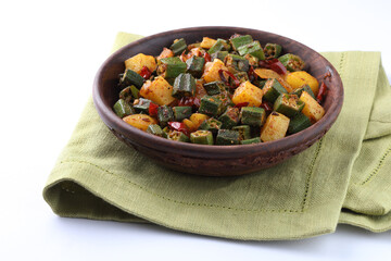 aloo bhindi or okra and potato side dish eaten with roti or chappati also called as Indian flat bread