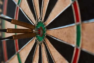 Dart arrow hit bullseye, close-up