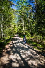 Young women walking in forest.