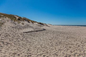 Dunes in the Slowinski National Park. Landscape with beautiful sky, clouds and dunes in the sun in Leba.